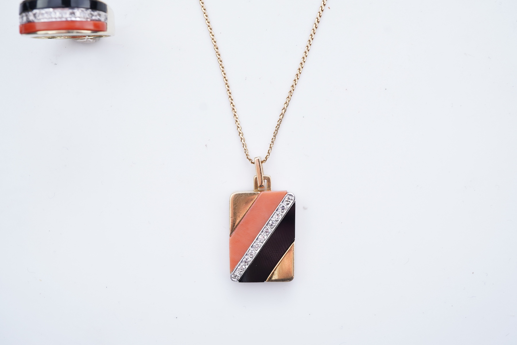 An onyx, coral and diamond demi-parure, circa 1976-7